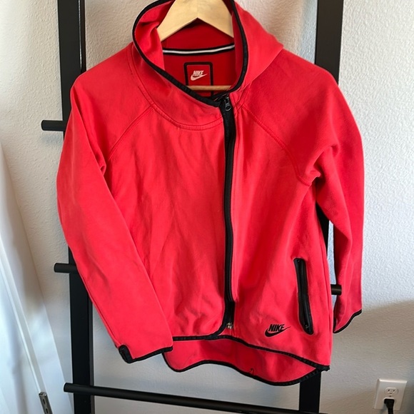 Bright red, hi/low zip up with hood. Zipper is off to the side. - Picture 1 of 3